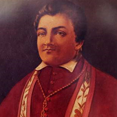 Portrait of Toronto Bishop Michael Power face and upper body, brown hair, wearing red robe.
