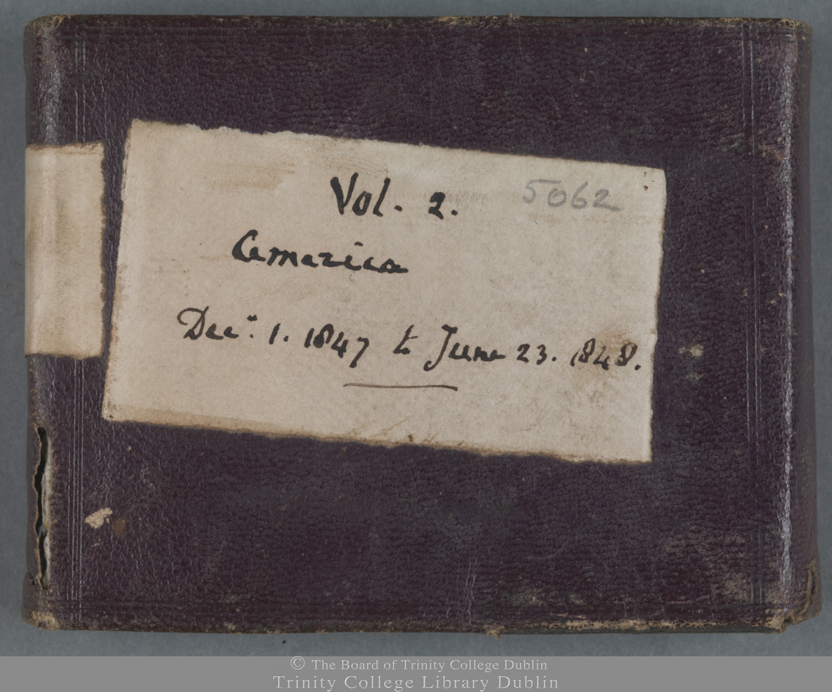Photograph of red leather bound journal with label: 5062. Vol. 2. America. Dec. 1, 1847 to June 23. 1848.
