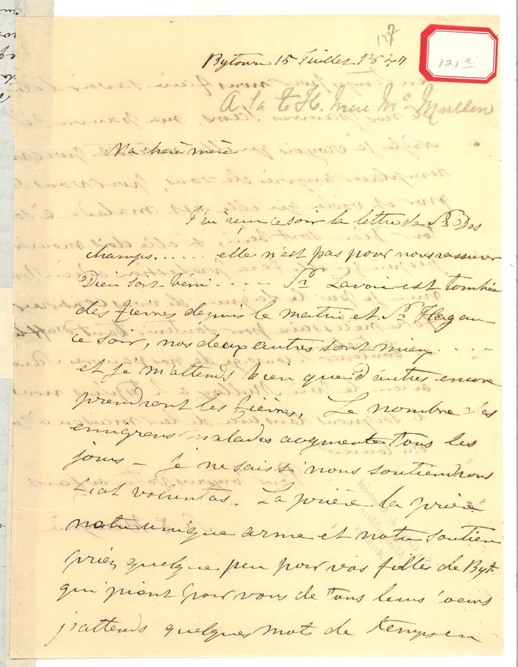 Document manuscrit, écrit en noir et blanc sur du papier jauni. Un encadré rouge y figure dans le haut de la page, à droite, indiquant une référence archivistique.