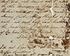 Handwritten letter in black ink on brown and yellowing paper, with brown staining and white scuff marks.