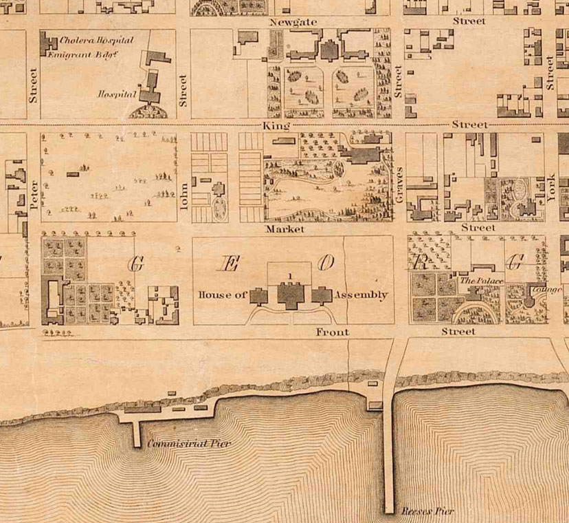 Black and white map with water front, wharves and street grid marking hospital site.